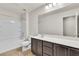Bathroom featuring a shower-tub combo, white walls, marble countertop, and dark brown cabinets at 7545 Fontera Ct, Las Vegas, NV 89139