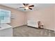 Charming Bedroom with a white crib, ceiling fan, natural lighting, and pink walls at 7545 Fontera Ct, Las Vegas, NV 89139
