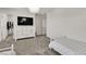 Bedroom featuring twin beds, large dresser, modern lighting, and neutral colors at 7545 Fontera Ct, Las Vegas, NV 89139