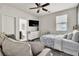 Cozy bedroom boasts a decorative brick wall and an en-suite bathroom at 7545 Fontera Ct, Las Vegas, NV 89139
