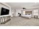 Spacious bedroom boasts plush carpet, a modern ceiling fan, and ample natural light at 7545 Fontera Ct, Las Vegas, NV 89139