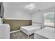 This clean bedroom has a white frame bed and wainscotting detail at 7545 Fontera Ct, Las Vegas, NV 89139