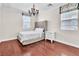 Cozy bedroom with hardwood floors, neutral walls, and a tufted headboard at 7545 Fontera Ct, Las Vegas, NV 89139