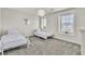 Bright bedroom with two beds and windows, showcasing natural light at 7545 Fontera Ct, Las Vegas, NV 89139