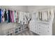Walk-in closet with organized shelves and hanging racks for clothing and shoes at 7545 Fontera Ct, Las Vegas, NV 89139
