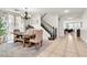 Elegant dining area with a wooden table, neutral chairs, and stylish decor at 7545 Fontera Ct, Las Vegas, NV 89139