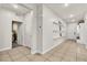 Hallway features tile flooring, a three-tier shelf, and access to a bedroom at 7545 Fontera Ct, Las Vegas, NV 89139
