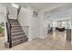 Welcoming entrance area leads to the living spaces, with stairs and a tiled floor at 7545 Fontera Ct, Las Vegas, NV 89139