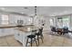 Stylish kitchen with center island, counter seating, and backyard access at 7545 Fontera Ct, Las Vegas, NV 89139