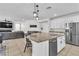 Bright kitchen island flows into adjacent living and dining spaces at 7545 Fontera Ct, Las Vegas, NV 89139