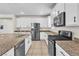 Modern kitchen featuring stainless steel appliances and granite countertops at 7545 Fontera Ct, Las Vegas, NV 89139