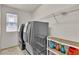 Laundry room with modern gray washer and dryer units at 7545 Fontera Ct, Las Vegas, NV 89139