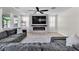Inviting living room with modern fireplace and large sectional sofa at 7545 Fontera Ct, Las Vegas, NV 89139