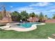 Inviting backyard pool and spa area is surrounded by lush greenery and manicured landscaping at 7545 Fontera Ct, Las Vegas, NV 89139