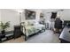 Relaxing bedroom with accent wall, daybed, and an adjacent work space at 7885 W Flamingo Rd # 1161, Las Vegas, NV 89147