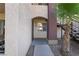 Close up of condo entrance with desert landscaping and stairs to upper units at 7885 W Flamingo Rd # 1161, Las Vegas, NV 89147
