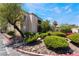 Condo complex with colorful landscaping and community parking at 7885 W Flamingo Rd # 1161, Las Vegas, NV 89147