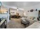 Spacious living room featuring neutral decor and view of the dining area at 7885 W Flamingo Rd # 1161, Las Vegas, NV 89147