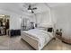 Spacious main bedroom with plush carpet, ceiling fan, and a large walk-in closet at 7885 W Flamingo Rd # 1161, Las Vegas, NV 89147