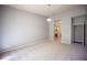 Neutral carpet throughout, light fixture and an open doorway to the bathroom and closet at 7911 Canoe Ln, Las Vegas, NV 89145