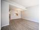 Dining room with hardwood floors, neutral paint and view to the kitchen at 7911 Canoe Ln, Las Vegas, NV 89145