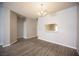 Hardwood floors and neutral paint in spacious dining room featuring view to kitchen at 7911 Canoe Ln, Las Vegas, NV 89145