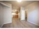Spacious living area with laminate flooring, neutral paint, and natural light at 7911 Canoe Ln, Las Vegas, NV 89145