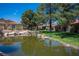 A tranquil pond surrounded by lush landscaping, creating a peaceful oasis within the community at 7911 Canoe Ln, Las Vegas, NV 89145
