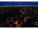 Aerial view of the community at twilight, showcasing the city skyline in the distance at 7940 Castle Pines Ave, Las Vegas, NV 89113