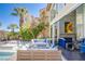 Outdoor patio featuring a gas fireplace, a pool, and comfortable lounging areas at 7940 Castle Pines Ave, Las Vegas, NV 89113