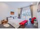 Inviting bedroom with large window, comfortable bed, and stylish decor at 7940 Castle Pines Ave, Las Vegas, NV 89113