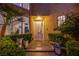 Inviting home entrance showcasing lush landscaping, tiled walkway, and stylish front door at 7940 Castle Pines Ave, Las Vegas, NV 89113