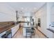 Spacious kitchen with white cabinets, stainless appliances, and large center island at 7940 Castle Pines Ave, Las Vegas, NV 89113