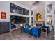 Spacious living room with a fireplace, large windows, contemporary decor and seamless indoor-outdoor flow at 7940 Castle Pines Ave, Las Vegas, NV 89113