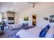Bright and airy main bedroom with a fireplace, large windows, and a walk-in closet at 7940 Castle Pines Ave, Las Vegas, NV 89113