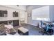 Bright home office with modern built-in cabinetry, desk space, and comfortable seating at 7940 Castle Pines Ave, Las Vegas, NV 89113