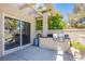 An outdoor kitchen with stainless steel appliances and built-in grill at 7940 Castle Pines Ave, Las Vegas, NV 89113