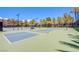 Well-maintained tennis courts with clear skies in a vibrant community setting at 7940 Castle Pines Ave, Las Vegas, NV 89113