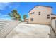 Large backyard with privacy wall and concrete patio at 7964 Lovely Pine Pl, Las Vegas, NV 89143