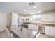 Well-lit kitchen with stainless steel appliances, granite countertops, and white cabinetry at 7964 Lovely Pine Pl, Las Vegas, NV 89143