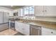Well-lit kitchen featuring granite countertops and stainless steel appliances at 7964 Lovely Pine Pl, Las Vegas, NV 89143