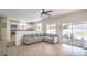 Open-concept living room features tile floors and seamlessly connects to the modern kitchen at 7964 Lovely Pine Pl, Las Vegas, NV 89143