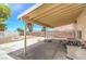 This patio is perfect for backyard relaxation with a picnic table, bench, and a basketball hoop at 7964 Lovely Pine Pl, Las Vegas, NV 89143