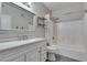 Clean bathroom with a tub and shower combination, a white vanity, and chrome hardware at 8250 N Grand Canyon Dr # 2001, Las Vegas, NV 89166