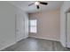 Bedroom with gray floors features a ceiling fan and plenty of natural light at 8250 N Grand Canyon Dr # 2001, Las Vegas, NV 89166