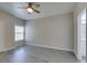 Bedroom featuring gray floors, a ceiling fan, and an ensuite bathroom at 8250 N Grand Canyon Dr # 2001, Las Vegas, NV 89166