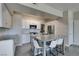 Modern kitchen with white cabinets, granite countertops, stainless steel appliances and a kitchen island at 8250 N Grand Canyon Dr # 2001, Las Vegas, NV 89166