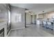 An open concept living area showcases wood-look floors, an attractive fireplace, and a view of the kitchen at 8250 N Grand Canyon Dr # 2001, Las Vegas, NV 89166