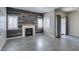 Inviting living area featuring wood-look floors, a fireplace, plantation shutters, and sliding doors at 8250 N Grand Canyon Dr # 2001, Las Vegas, NV 89166