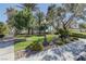 Beautiful community park featuring manicured lawns, mature trees, and decorative streetlights at 8300 Slate Harbor Cir, Las Vegas, NV 89128